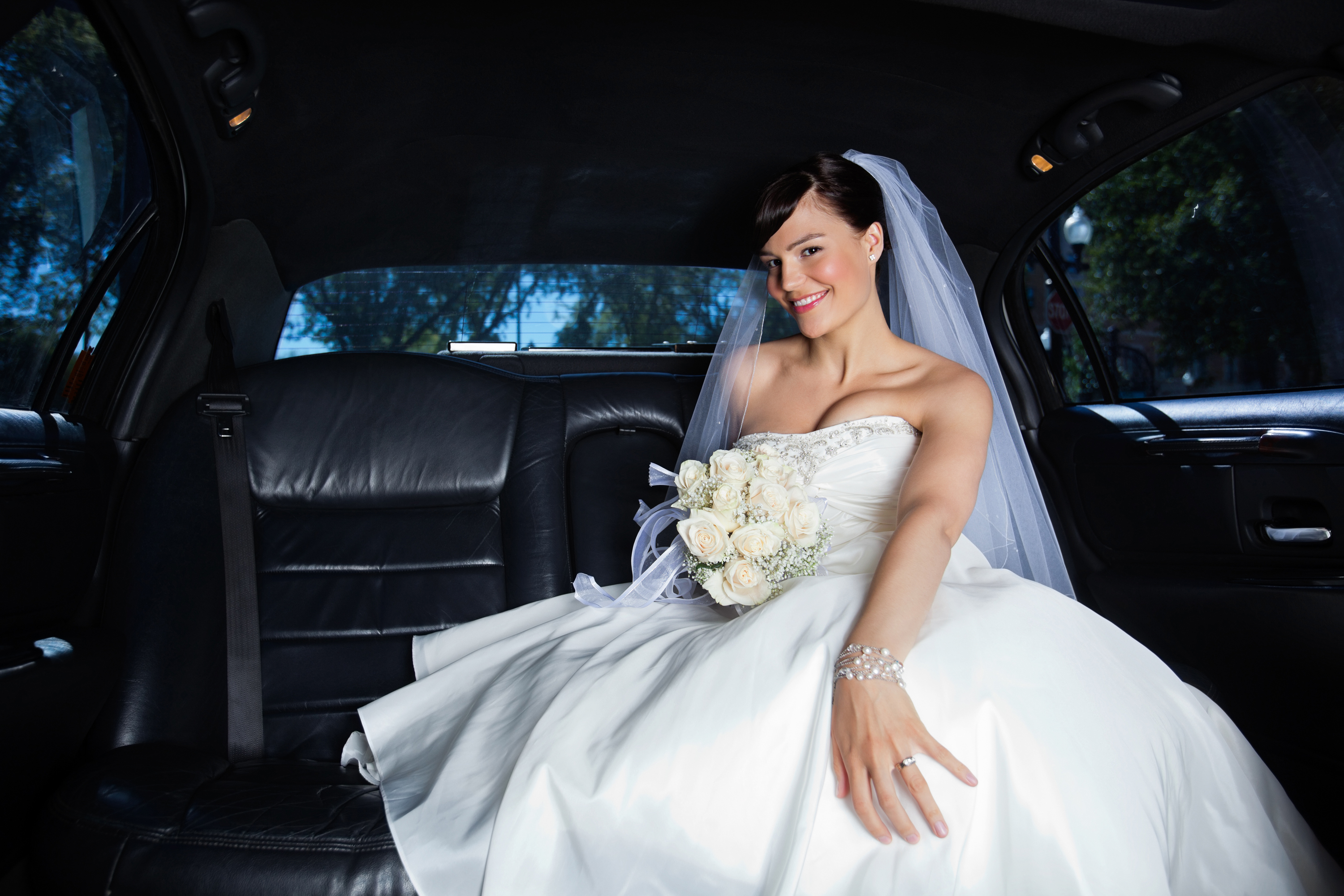 bigstock-Beautiful-bride-sitting-in-car-29877425